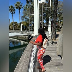 Two piece orange and white crop top set. Very comfortable outfit